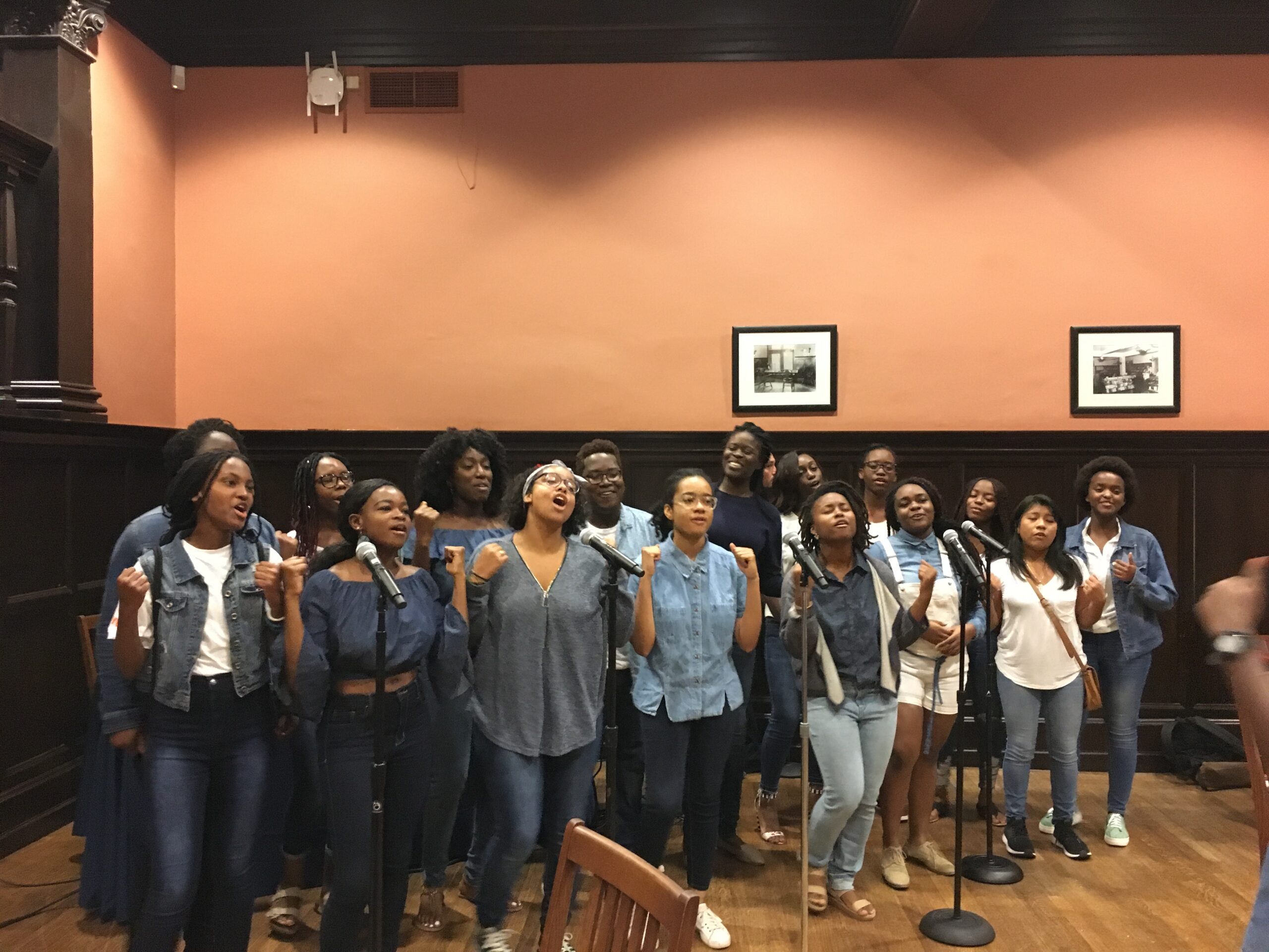 New Spirit of Penn, an a cappella troupe, performs in the Houston Hall Reading room