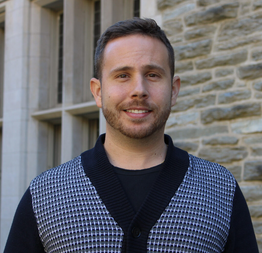 David Spinosa Headshot in front of Houston Hall